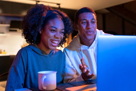 Happy couple with laptop